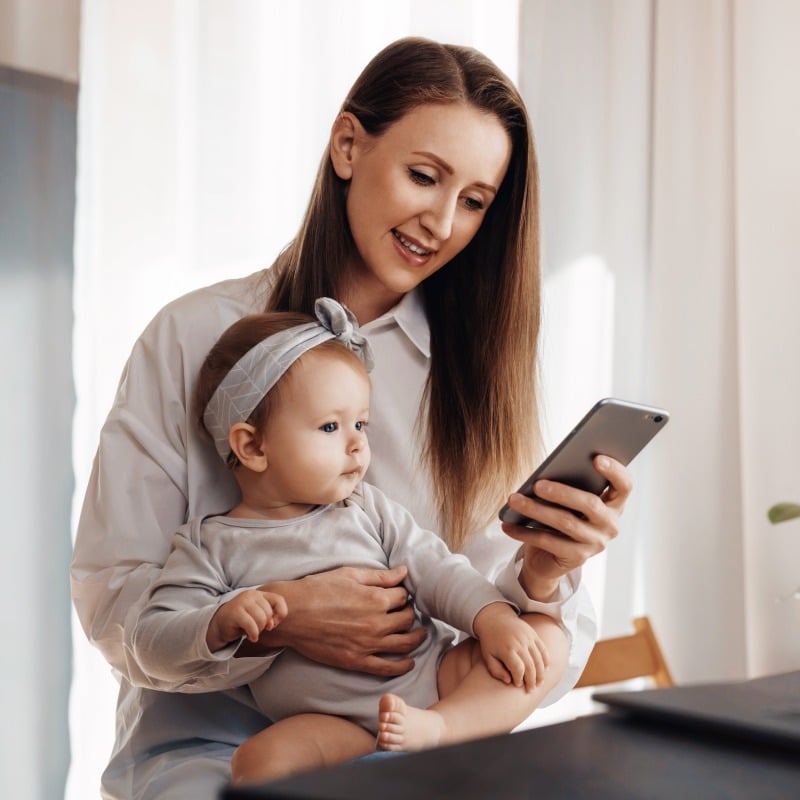 1-mom-with-baby-banking-on-phone