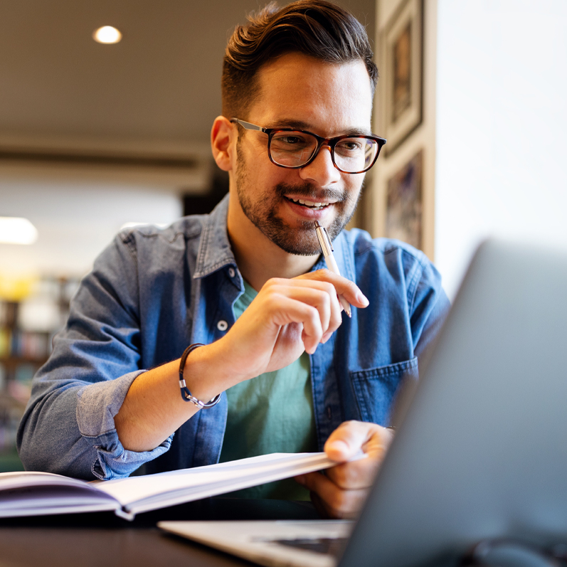 man studying for certification class with laptop