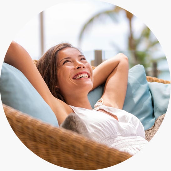 happy woman relaxing on dream vacation purchased with home equity loan