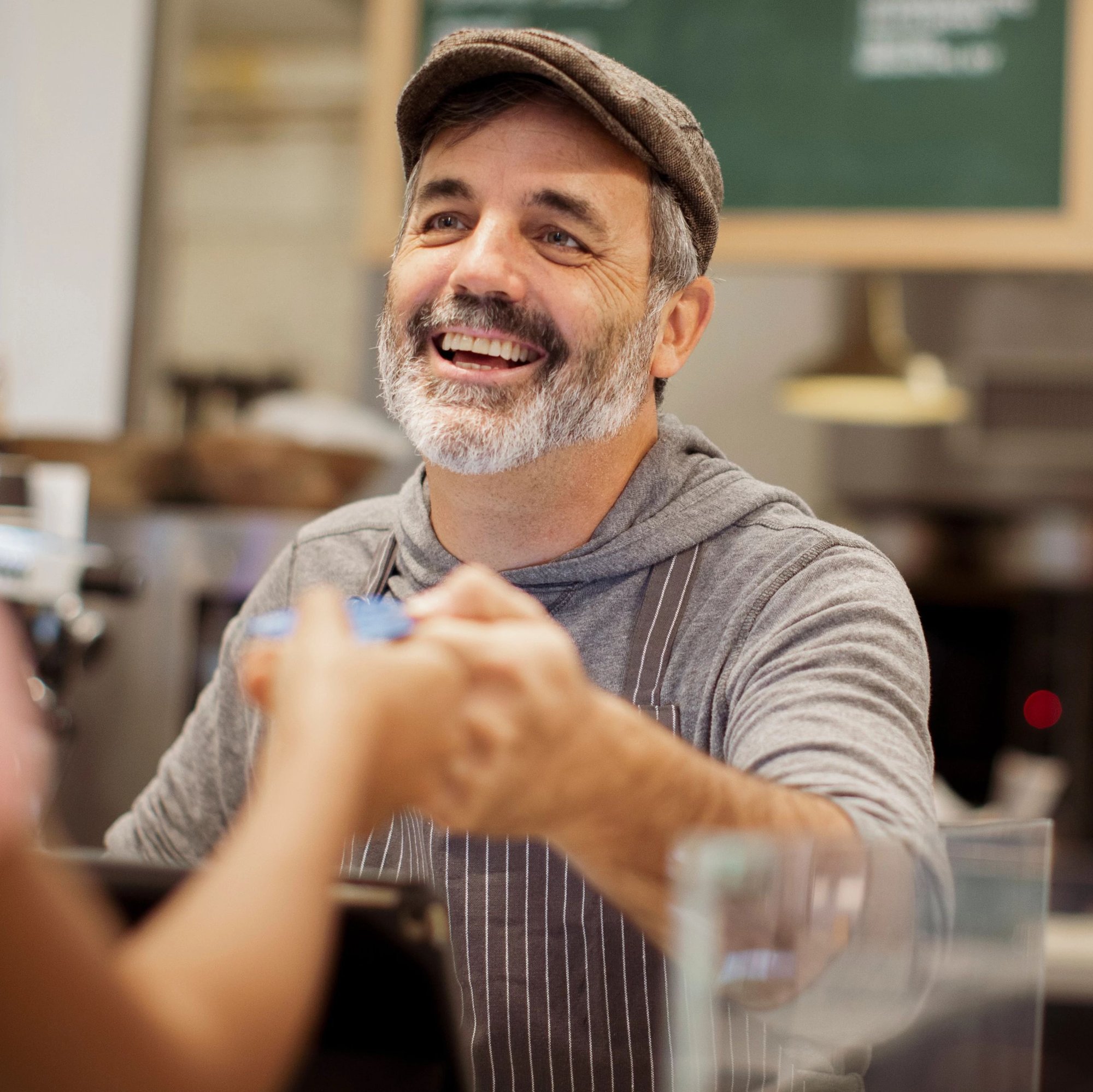 Business Owner Taking Card