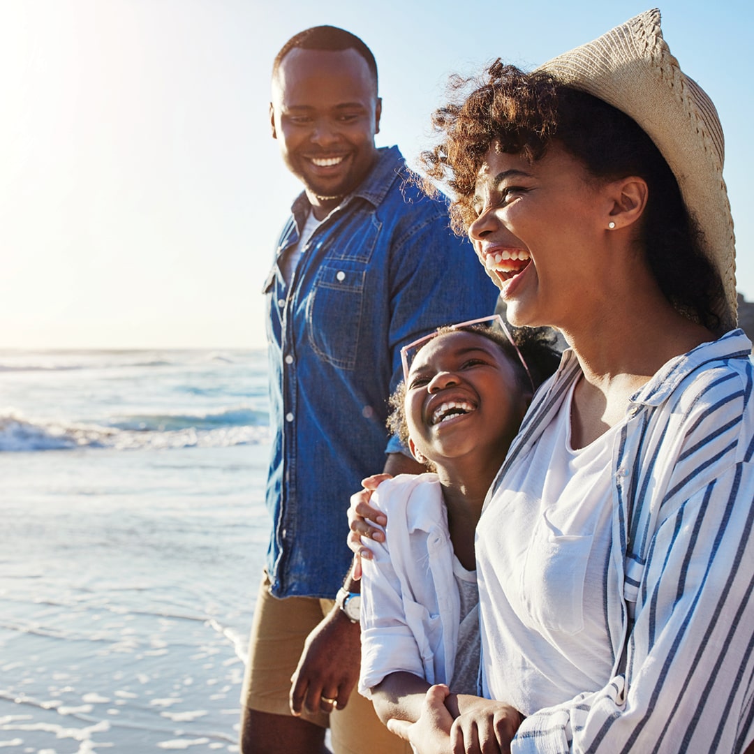 A happy family on the beach enjoying a family vacation