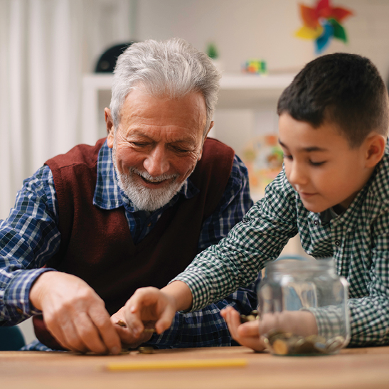 old man counting coins with young boy ready to open a kids savings account