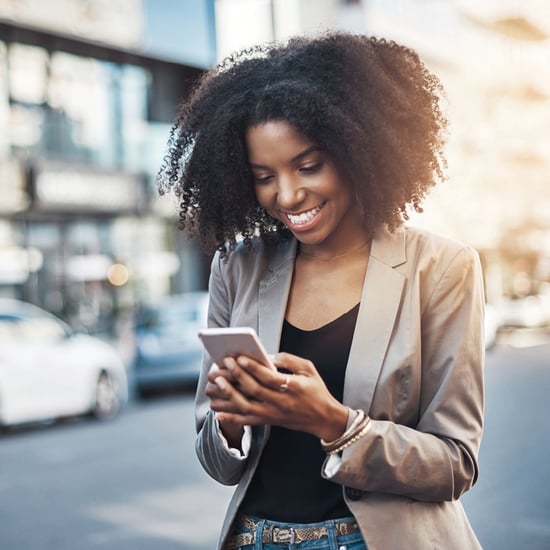 young woman in sports coat on mobile phone