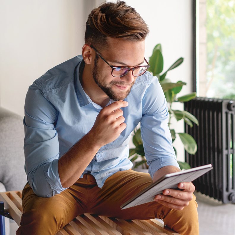 Man looking at tablet