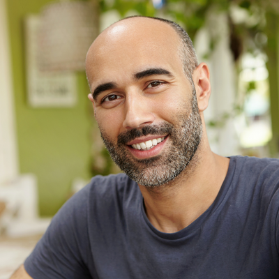 Man-with-beard-smiling-at-camera