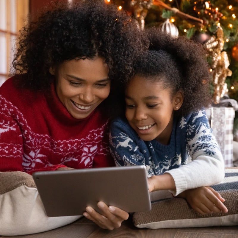 Mother and Daughter On Tablet