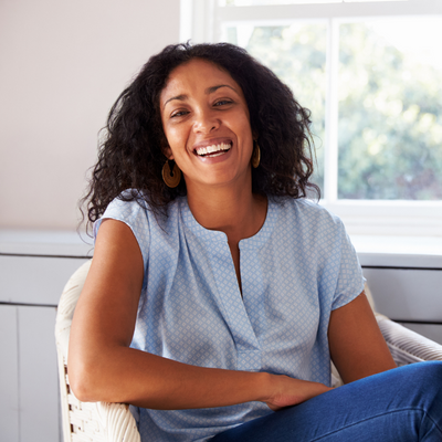 Woman-by-window-smiling