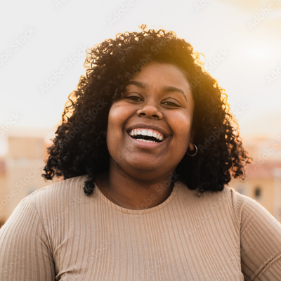 Woman-smiling-at-sunset