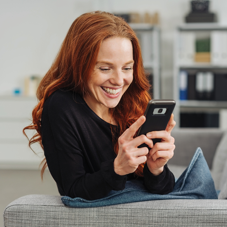 Young-Woman-Looking-At-Phone