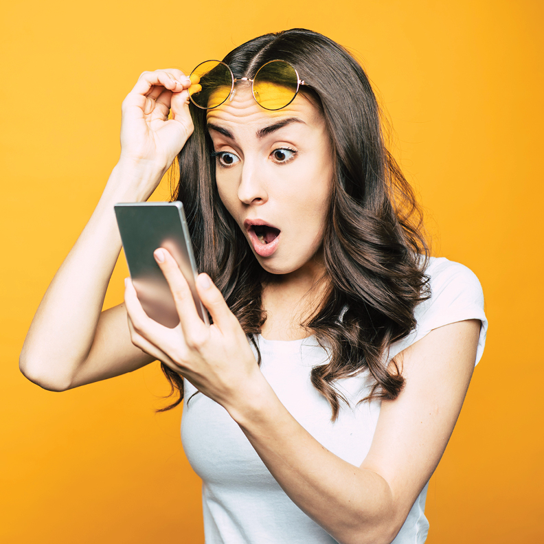 surprised-woman-looking-at-phone