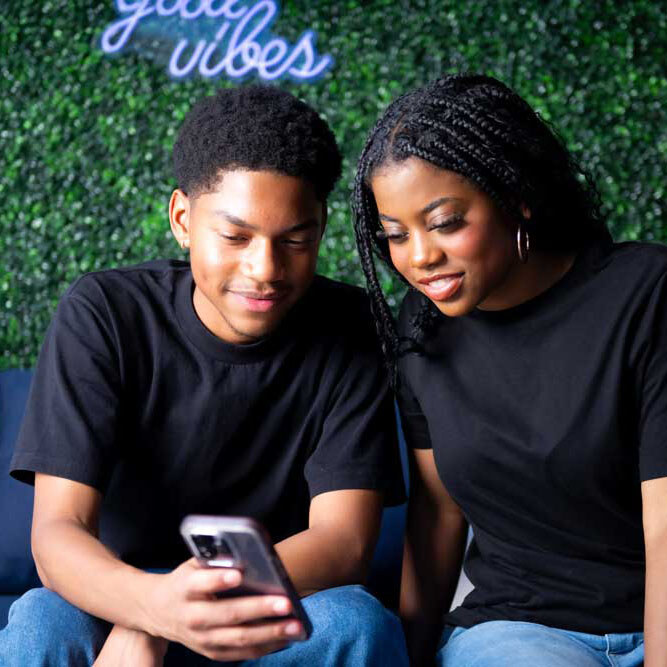 Teens looking at phone