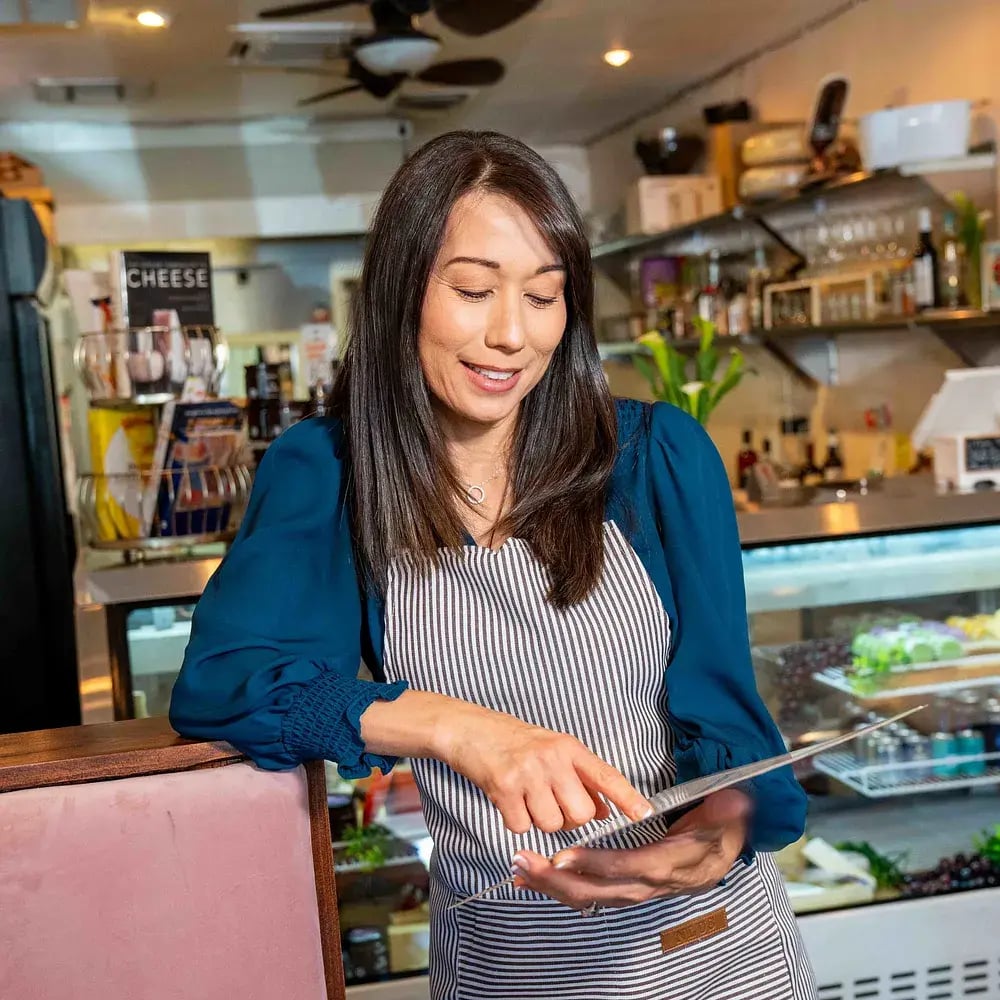 woman-business-owner-with-tablet