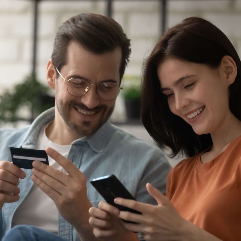 young couple shopping online with credit card