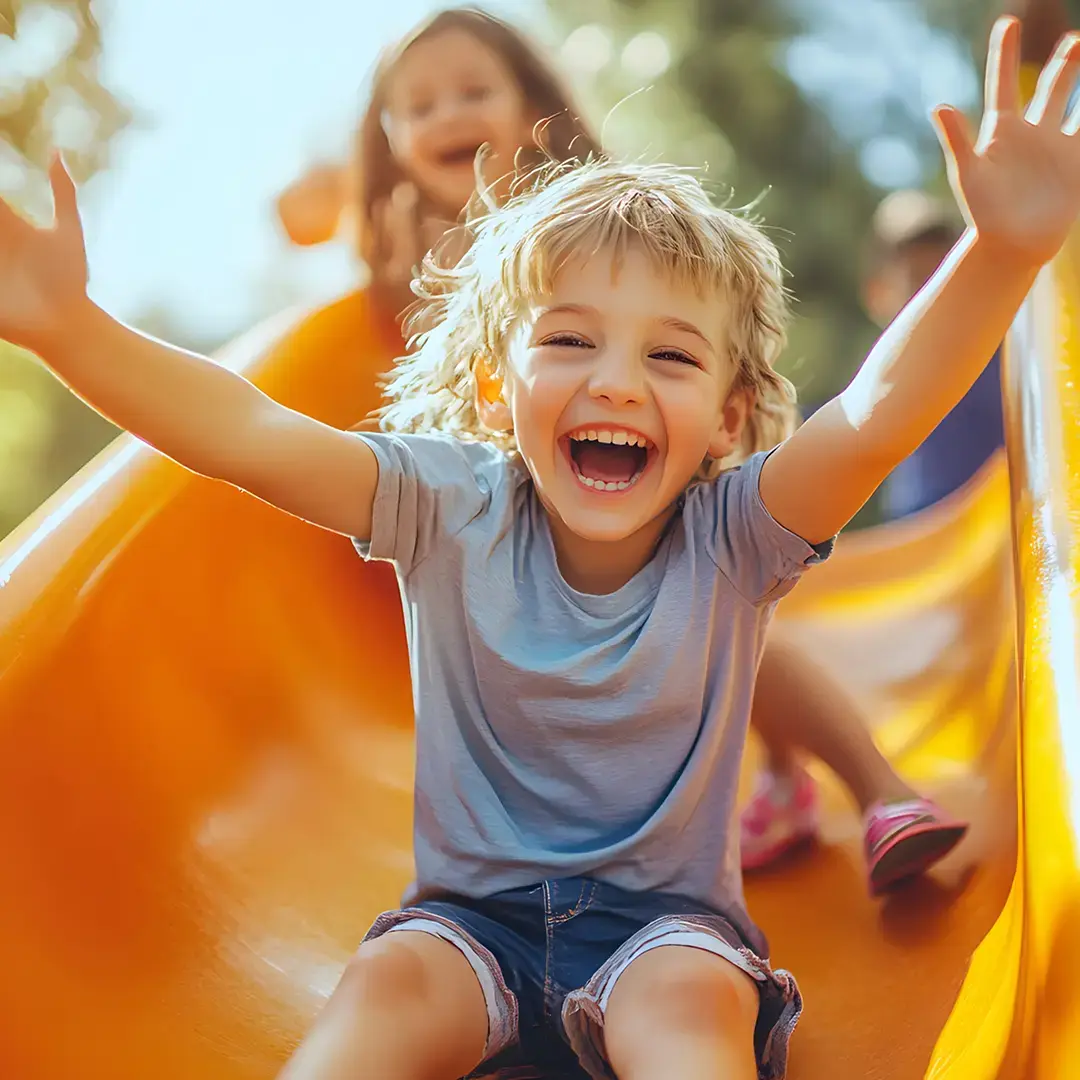 children-sliding-in-playground